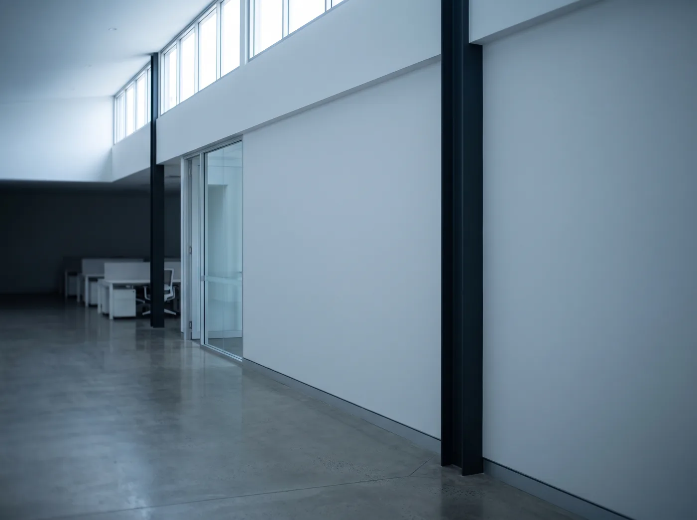 A painted commercial interior with a long wall and quiet even light